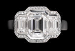 A Unique & Very Special Emerald Cut Diamond Three Stone Cluster Ring