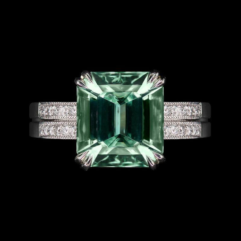 A Step-Cut Green Tourmaline single stone ring with Diamond set shoulders
