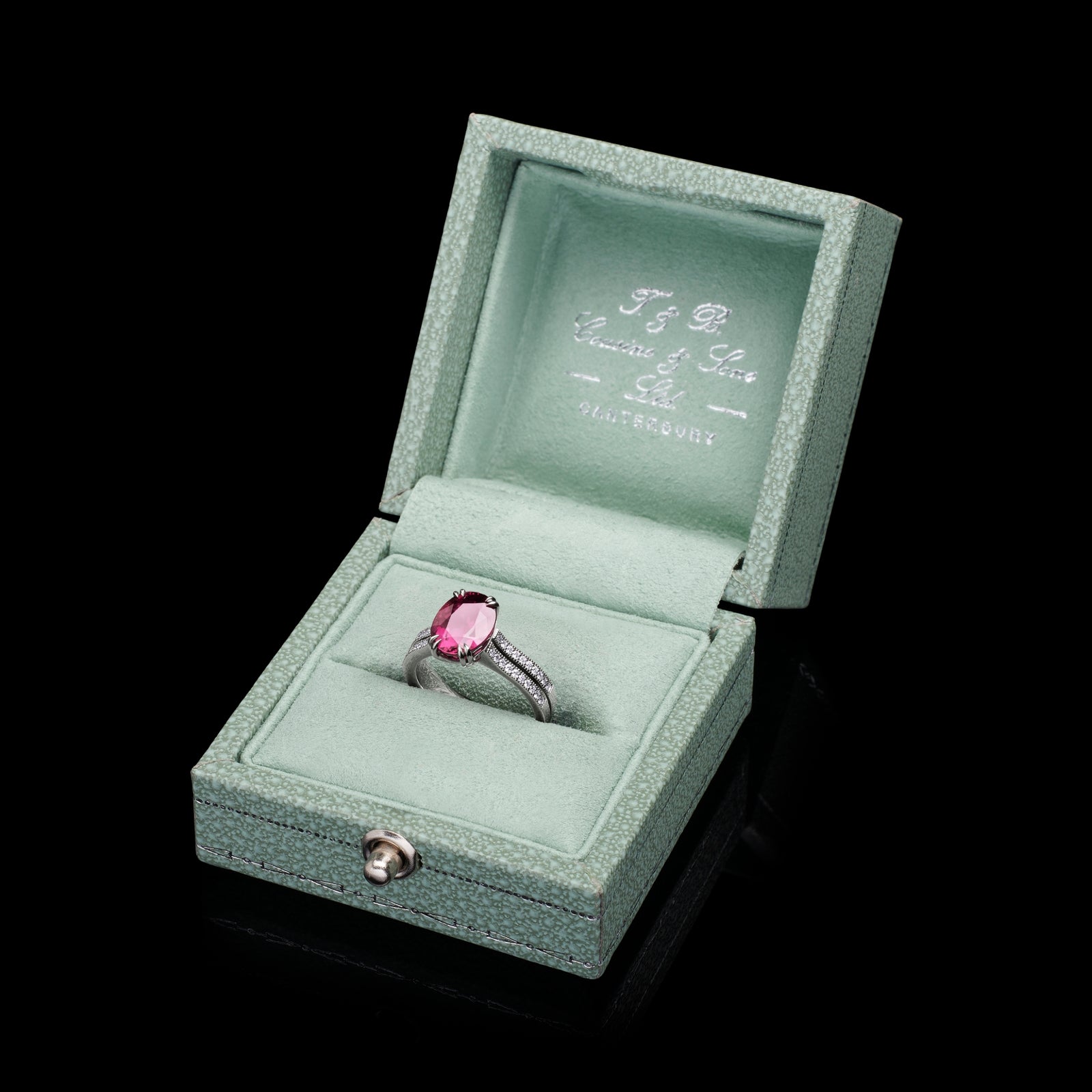 A Very Beautiful Ruby Single Stone Ring with Twin Diamond Set Rail Shoulders