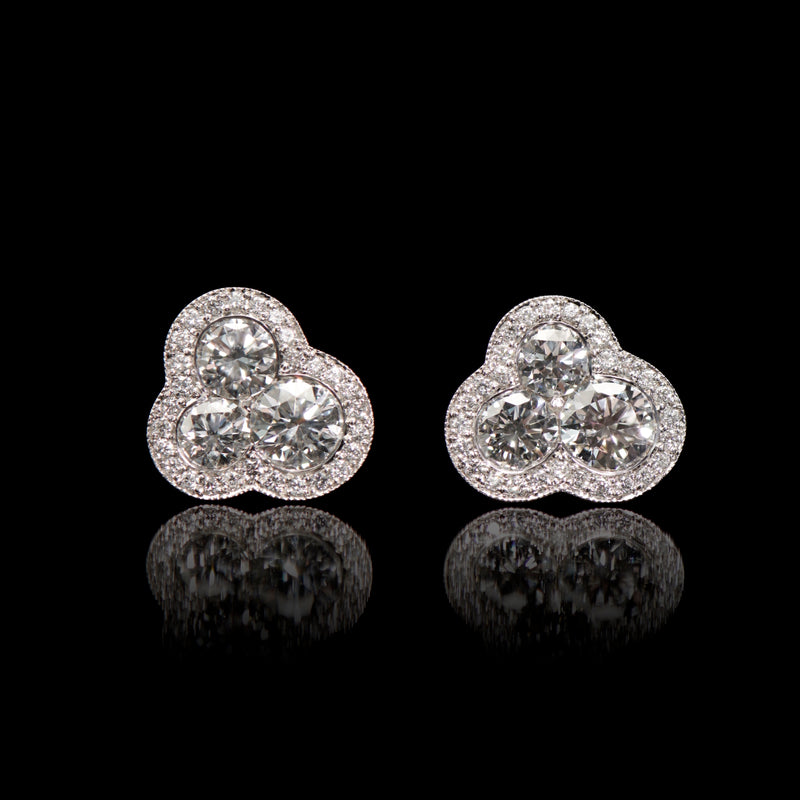 A pair of diamond trefoil cluster earrings