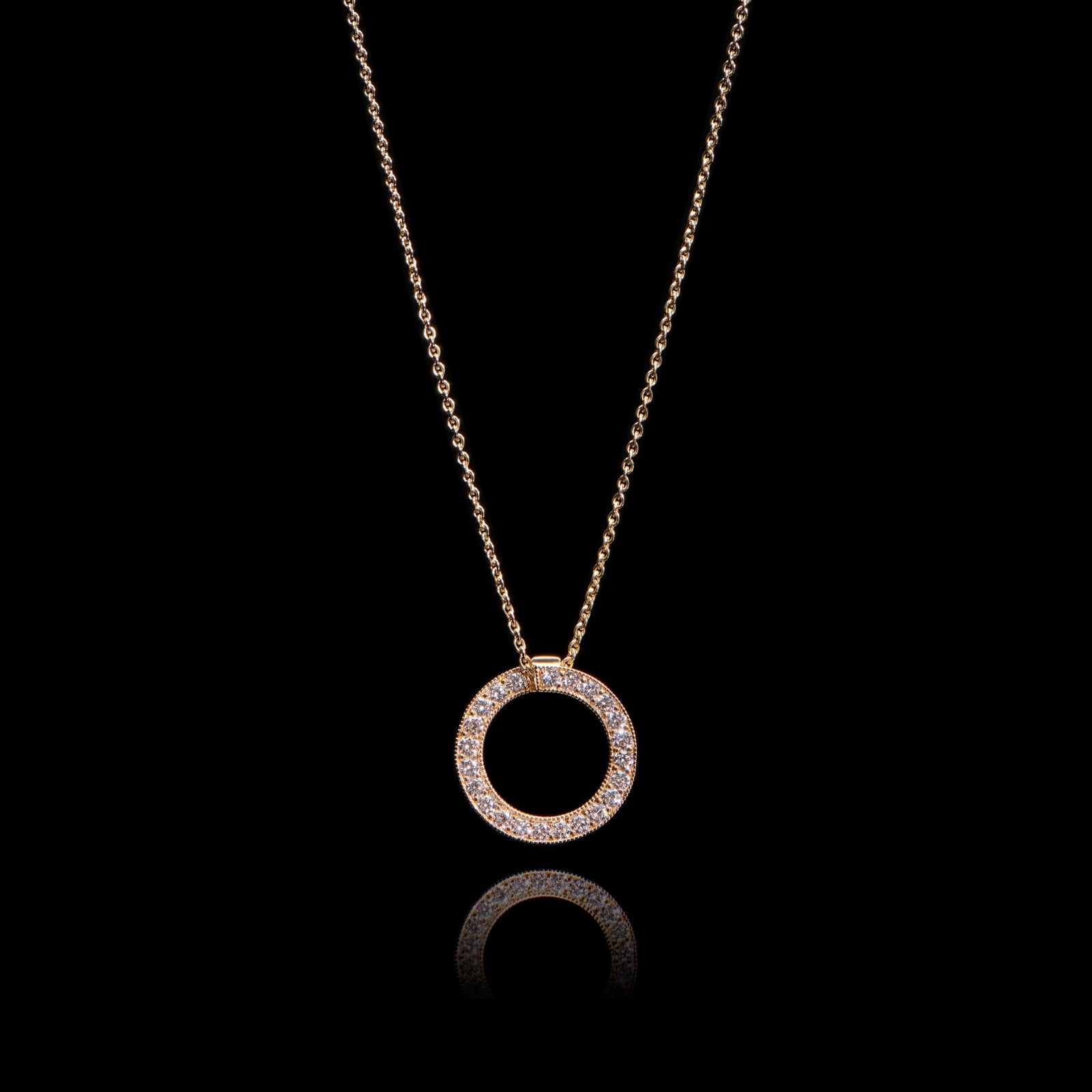 A diamond circlet pendant in yellow gold