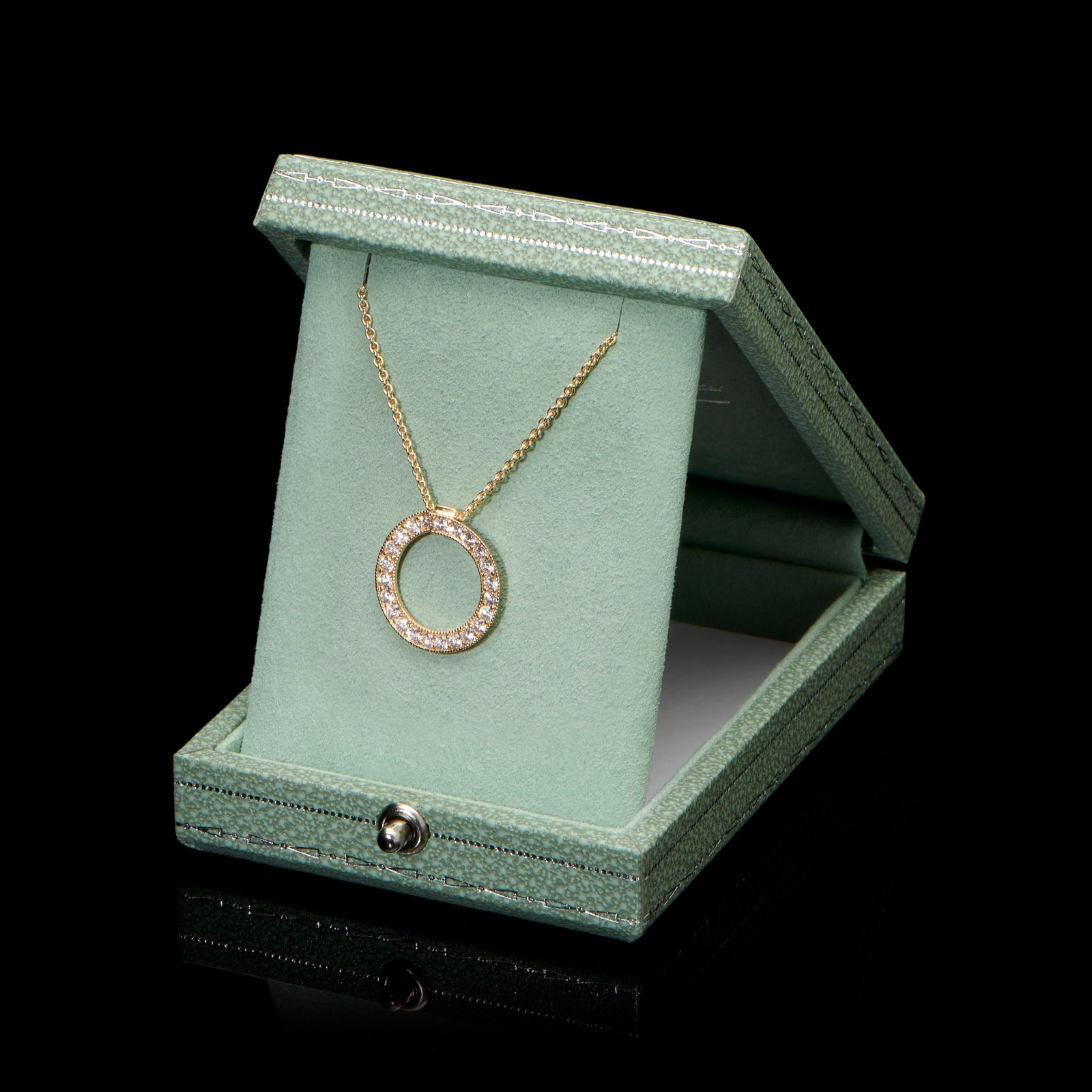 A diamond circlet pendant in yellow gold