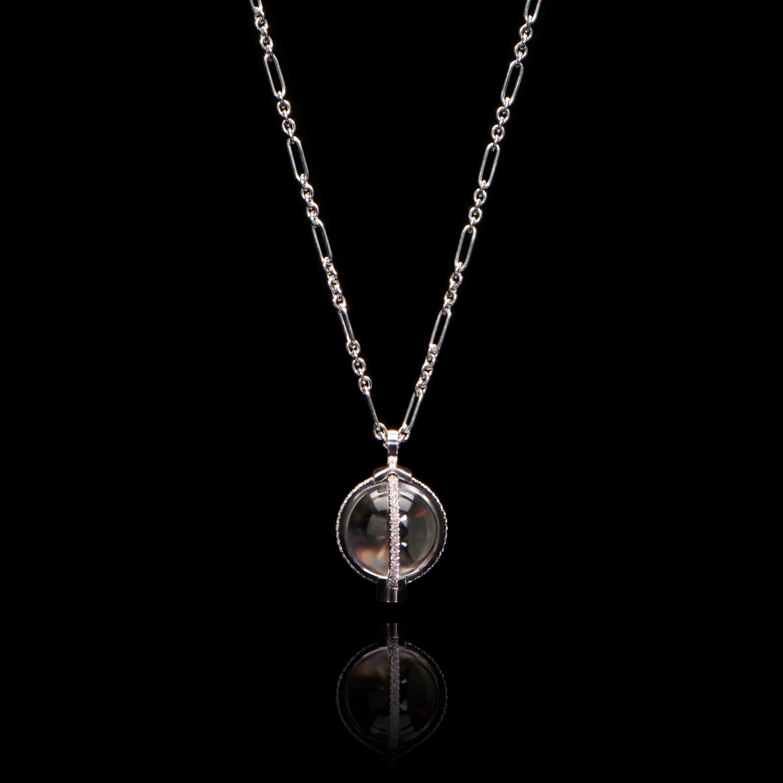 A rock crystal & diamond orb pendant