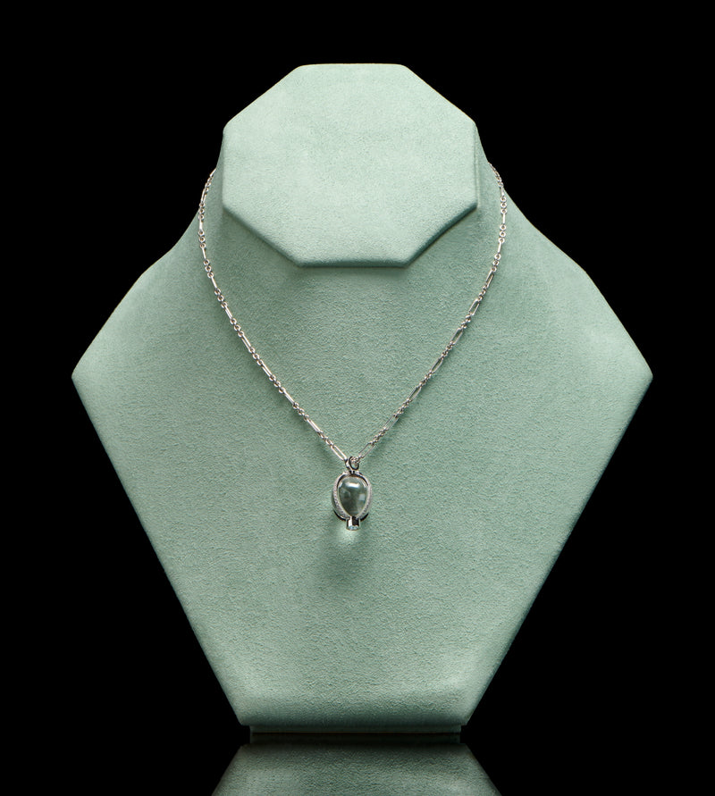 A rock crystal & diamond orb pendant