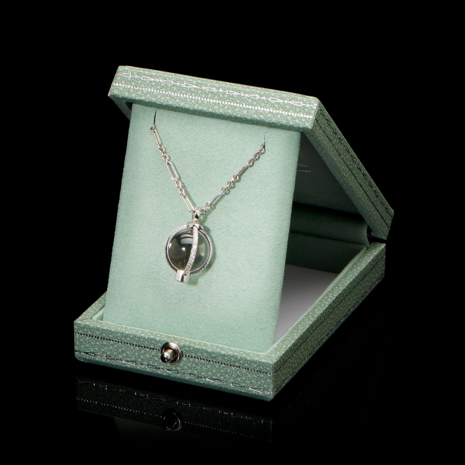 A rock crystal & diamond orb pendant