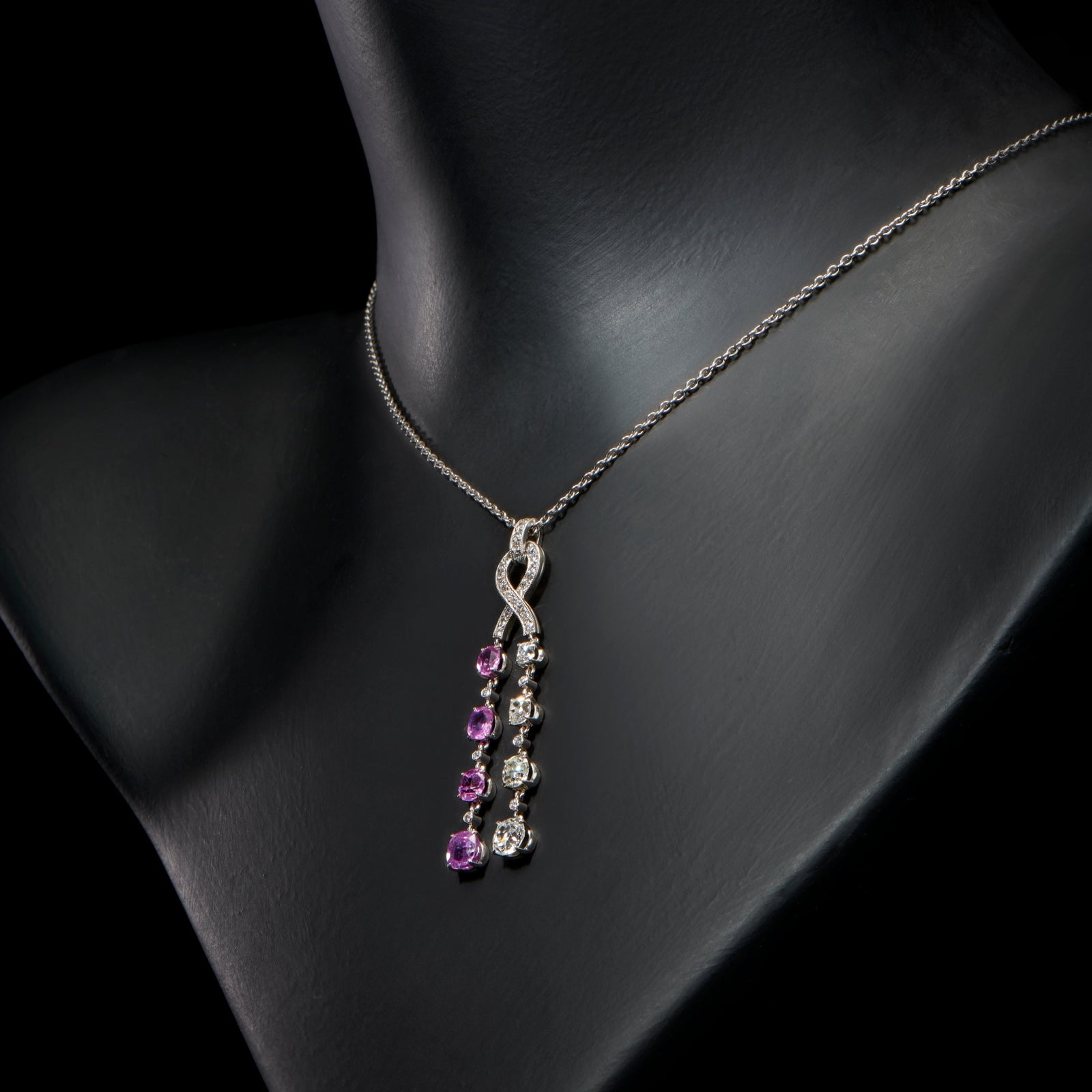 A twin cascade pink sapphire & diamond pendant