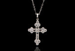 A brilliant & carree cut diamond Cousins cross, in all platinum
