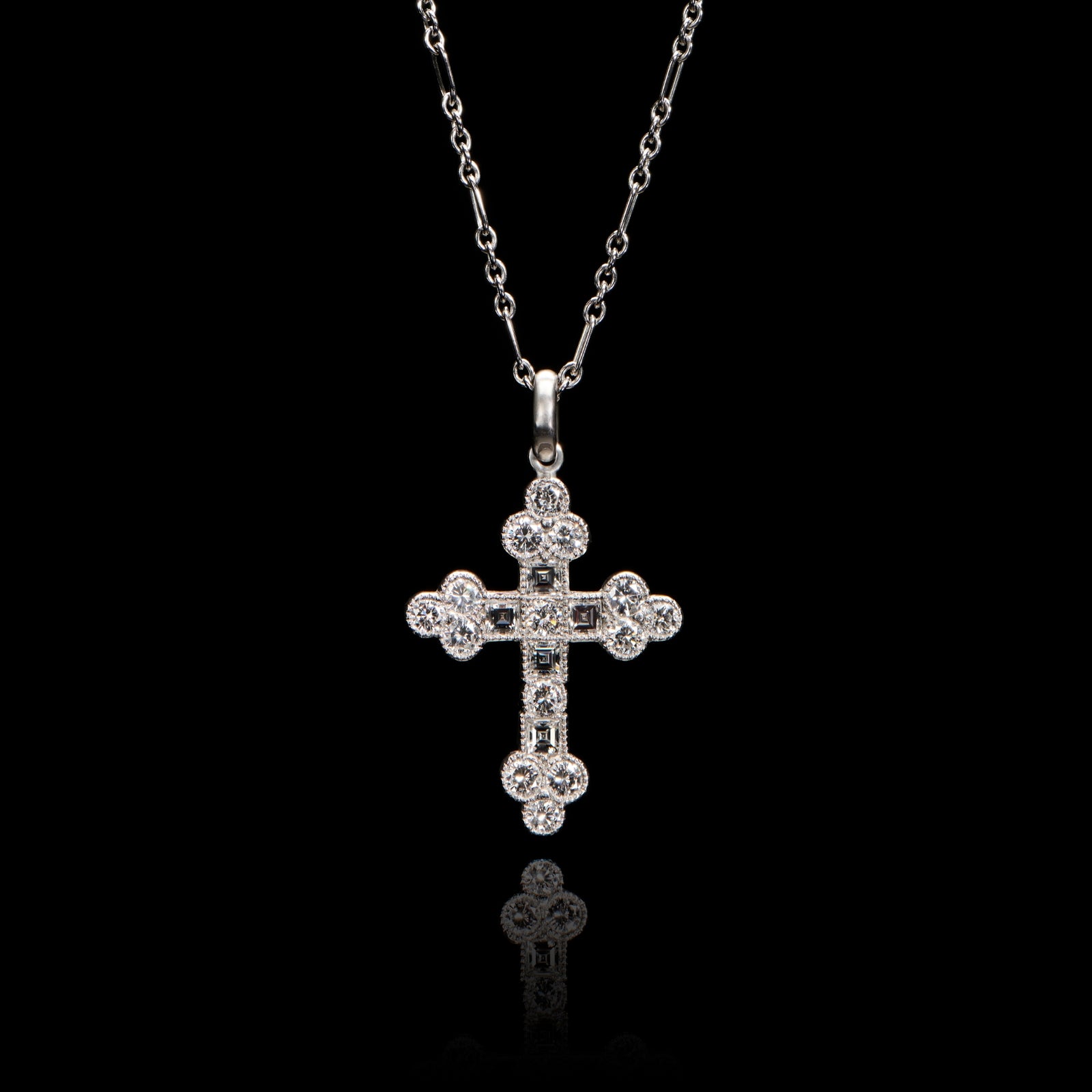 A brilliant & carree cut diamond Cousins cross, in all platinum