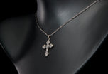 A brilliant & carree cut diamond Cousins cross, in all platinum