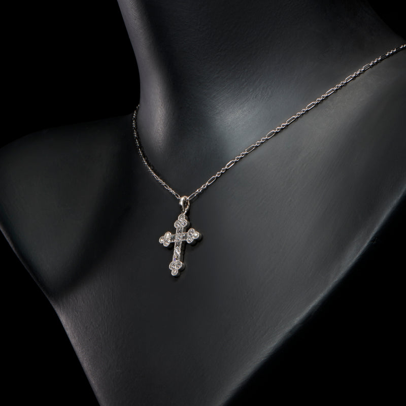 A brilliant & carree cut diamond Cousins cross, in all platinum
