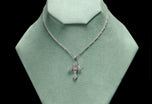 A brilliant & carree cut diamond Cousins cross, in all platinum