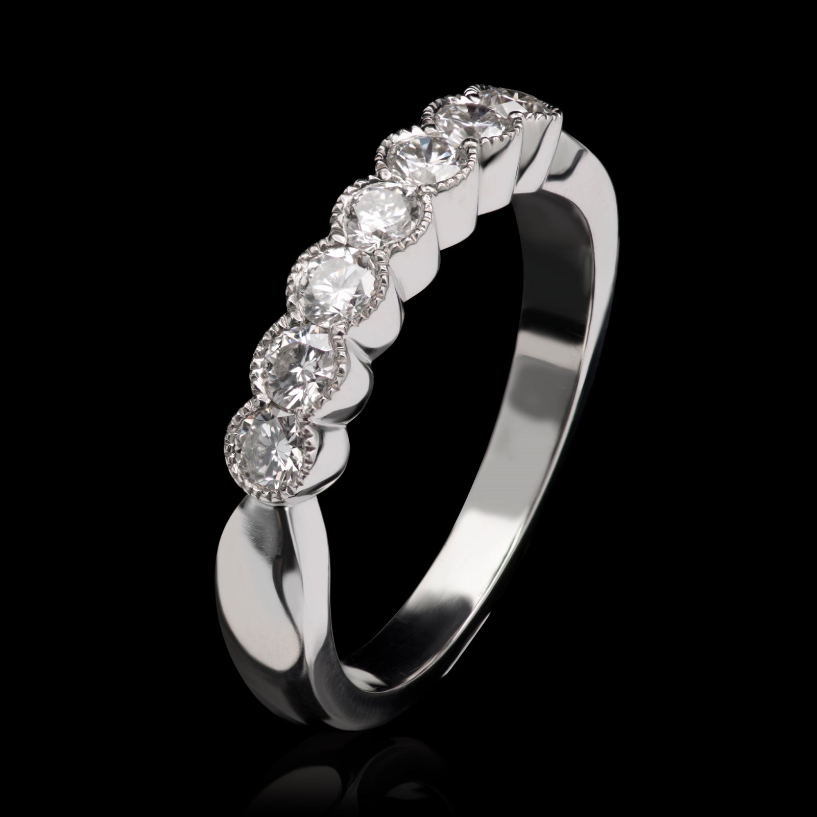 A Classically Elegant Seven Stone Diamond Half Hoop Eternity Ring