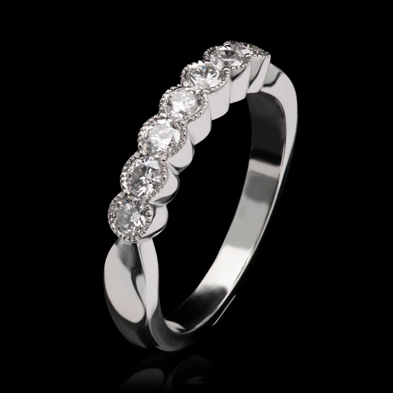A Classically Elegant Seven Stone Diamond Half Hoop Eternity Ring