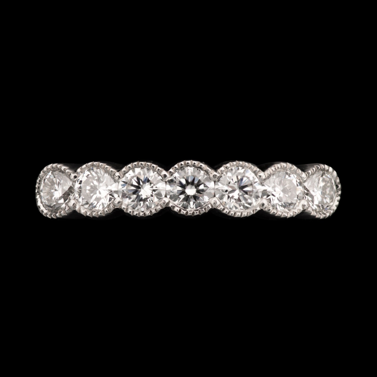 A Classically Elegant Seven Stone Diamond Half Hoop Eternity Ring