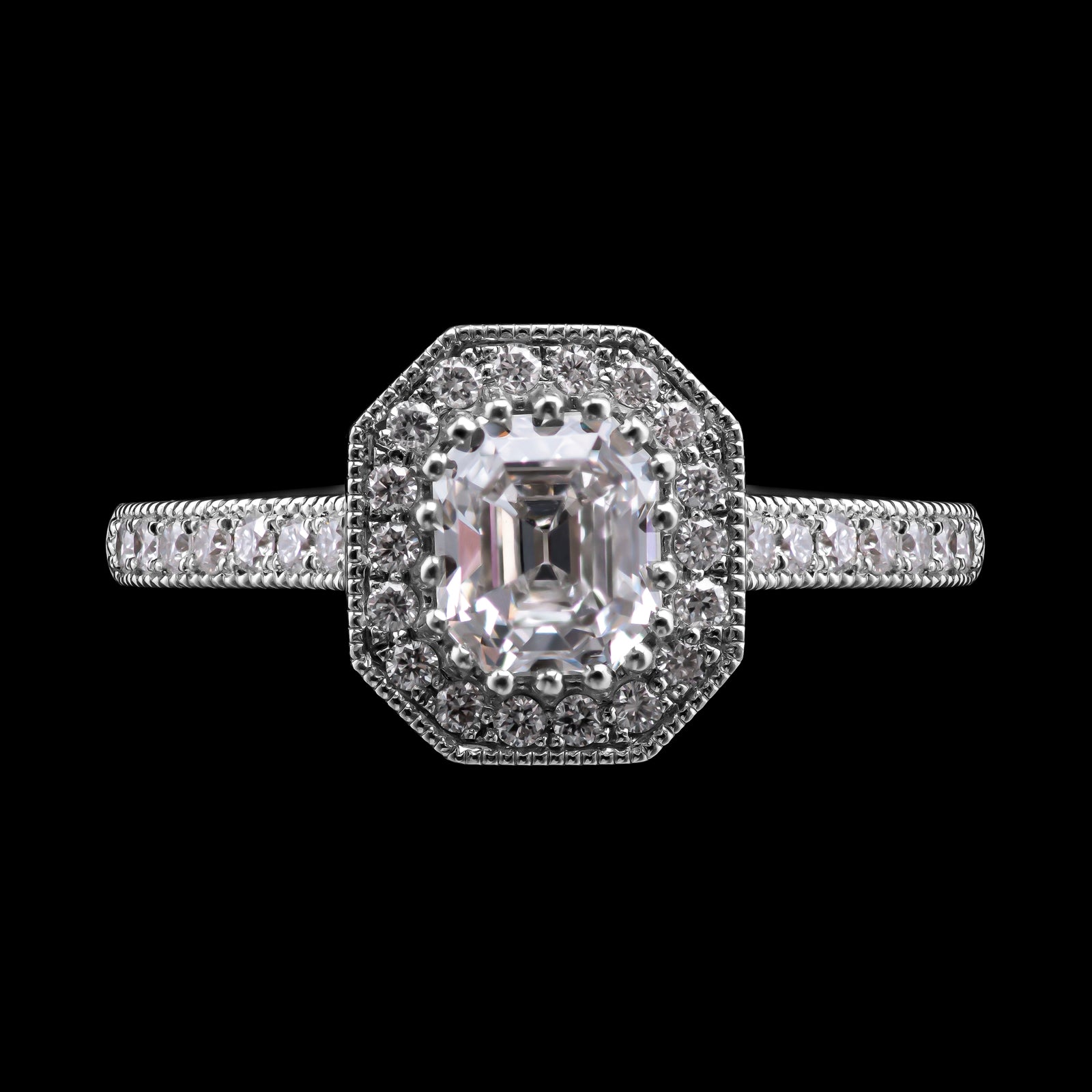 A Fine Quality Emerald Cut Diamond Cluster Ring