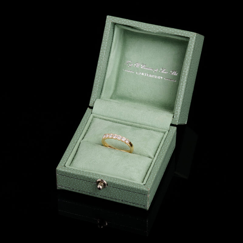A Classically Elegant Seven Stone Diamond Half Hoop Eternity Ring