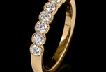 A Classically Elegant Seven Stone Diamond Half Hoop Eternity Ring