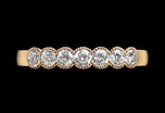 A Classically Elegant Seven Stone Diamond Half Hoop Eternity Ring