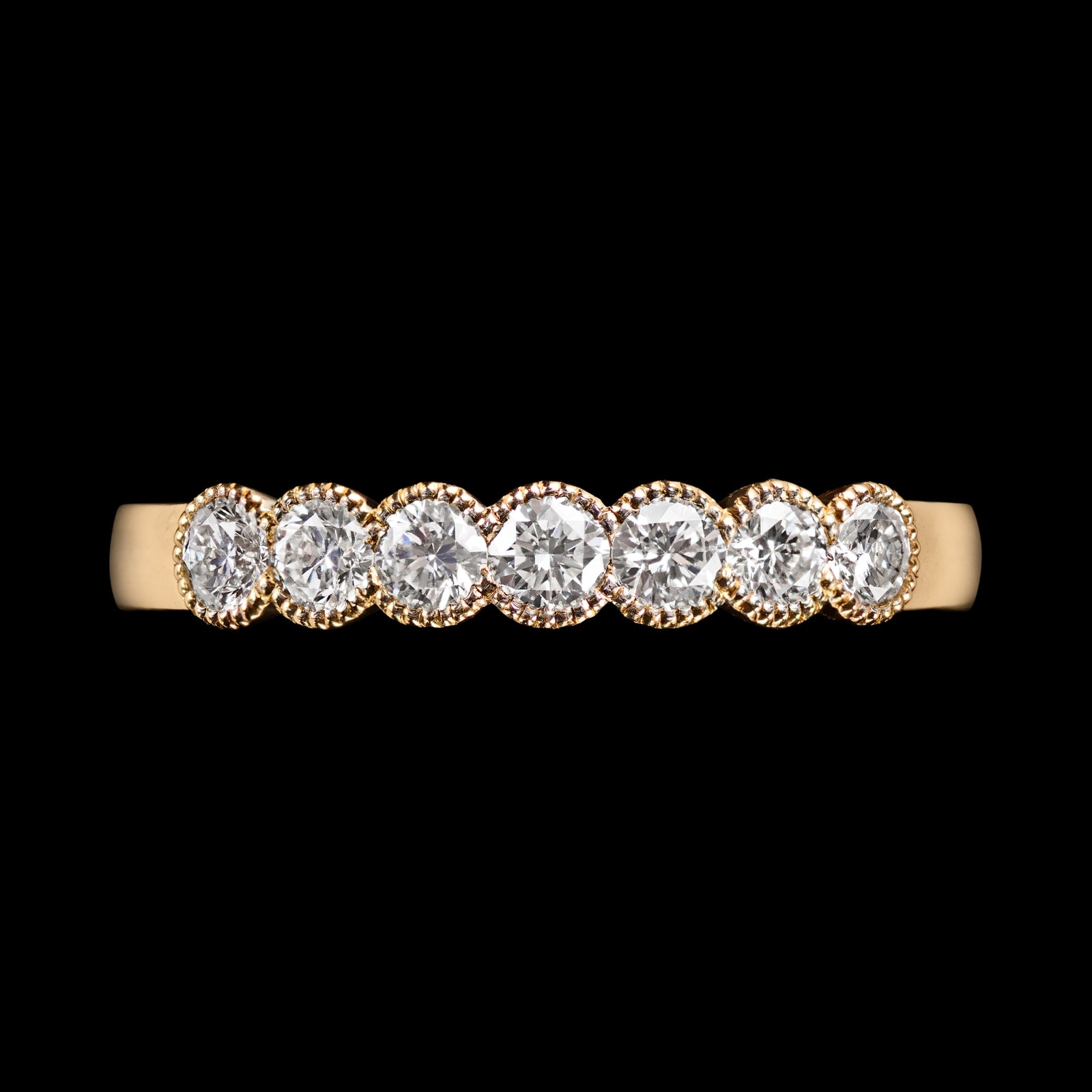 A Classically Elegant Seven Stone Diamond Half Hoop Eternity Ring