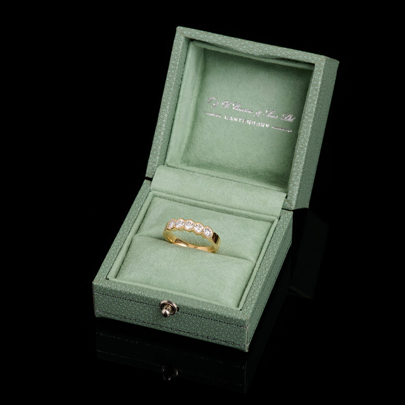 A Diamond Five Stone Half Hoop Half Eternity Ring with Scalloped Edge Settings