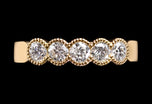 A Diamond Five Stone Half Hoop Half Eternity Ring with Scalloped Edge Settings
