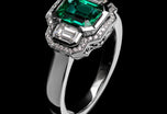 An Emerald & Diamond Three Stone Cluster Ring