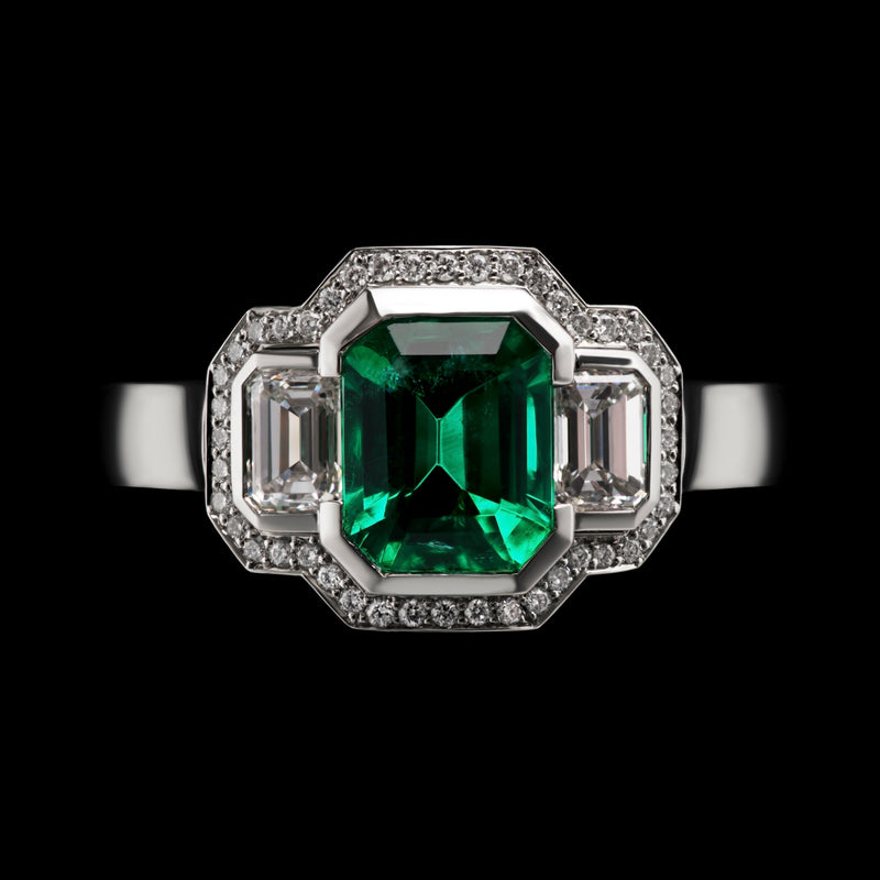 An Emerald & Diamond Three Stone Cluster Ring