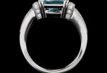 An Aquamarine single stone Ring with Diamond set shoulders.