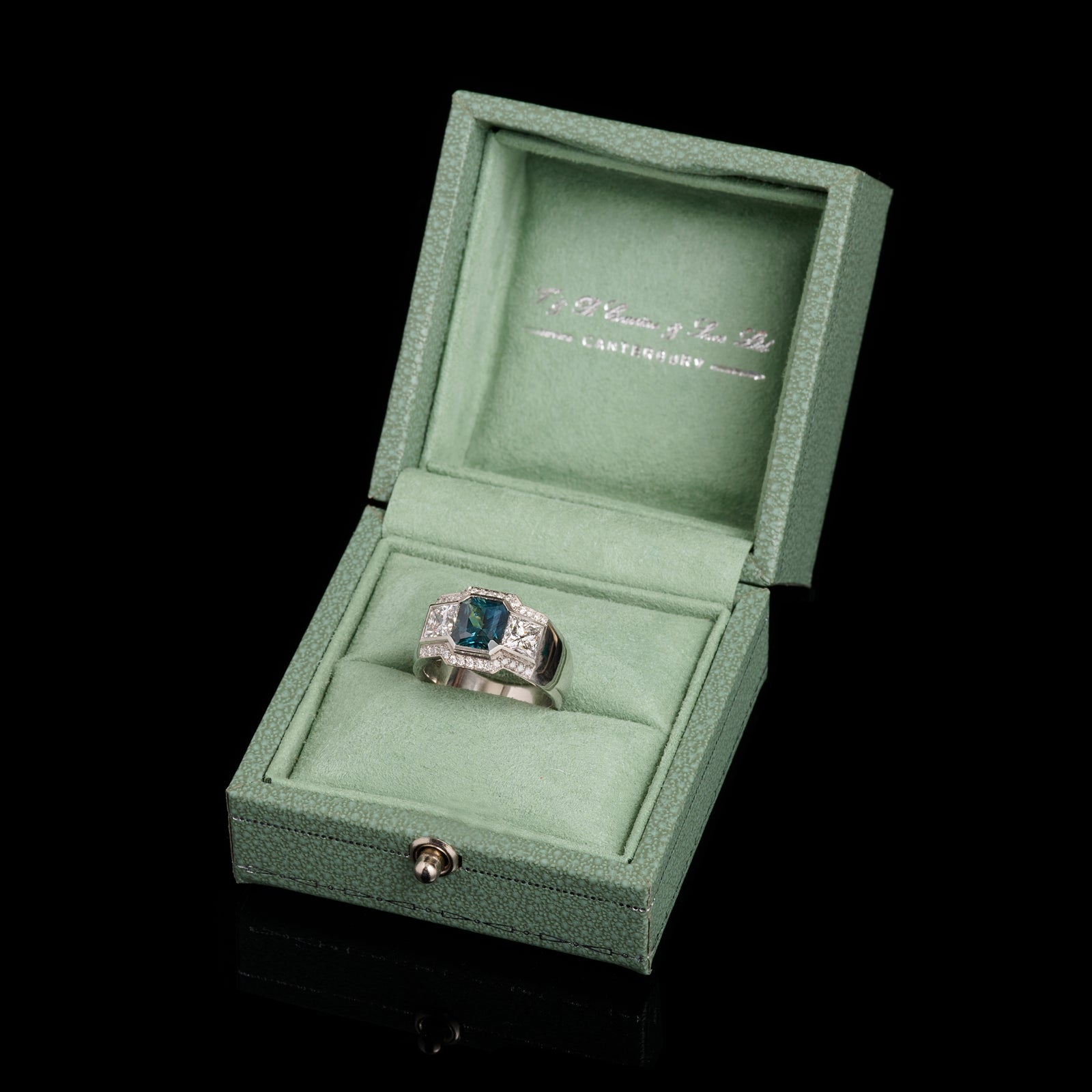 A Unique Teal Sapphire & Princess Cut Diamond Cluster Ring