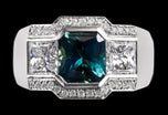 A Unique Teal Sapphire & Princess Cut Diamond Cluster Ring