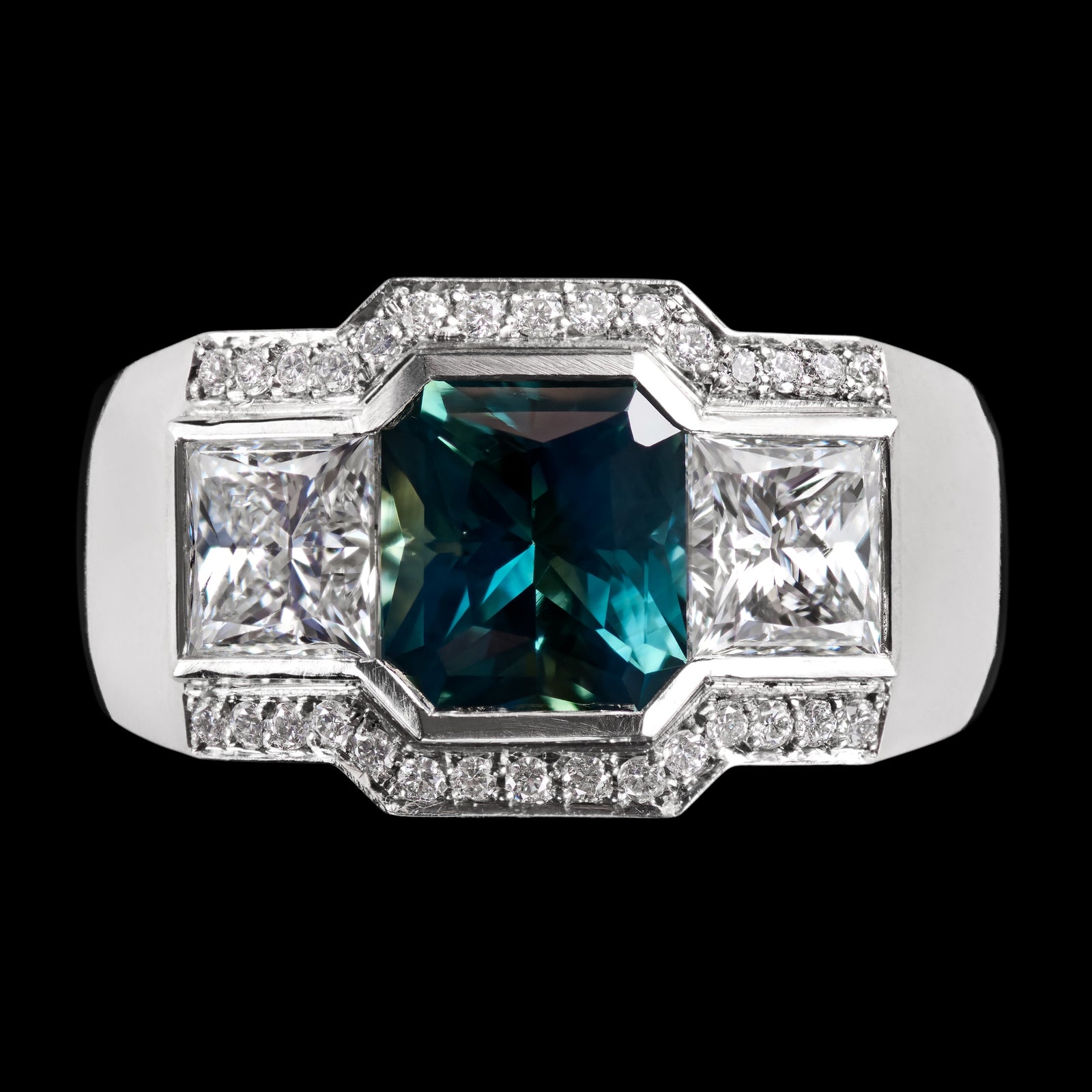 A Unique Teal Sapphire & Princess Cut Diamond Cluster Ring