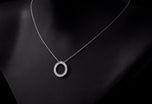 A diamond circlet pendant in Platinum