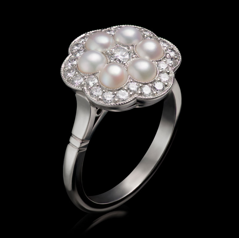 A Natural Half Pearl & Diamond Cluster Ring