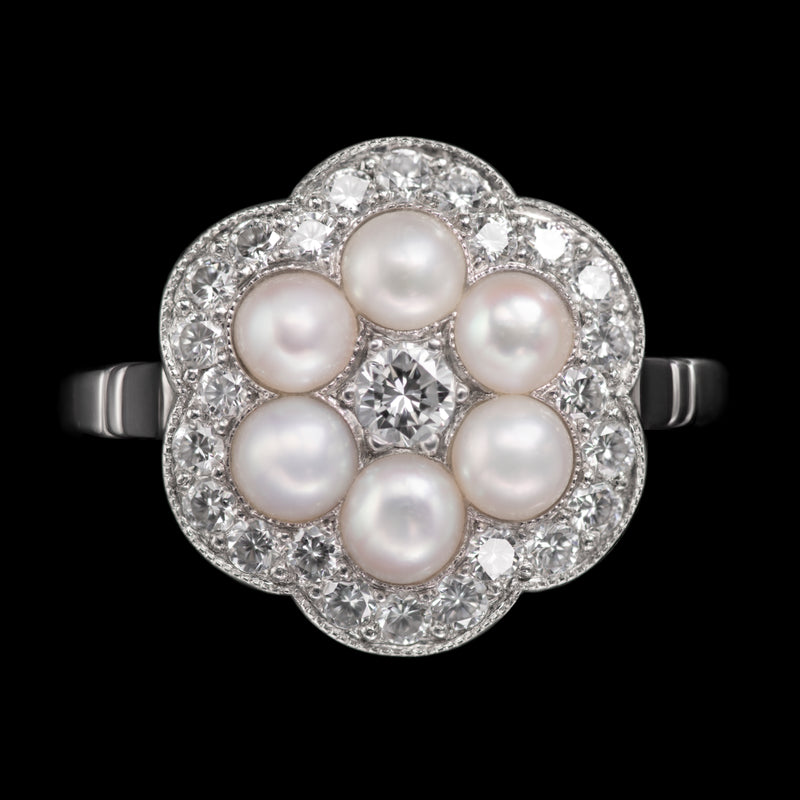 A Natural Half Pearl & Diamond Cluster Ring