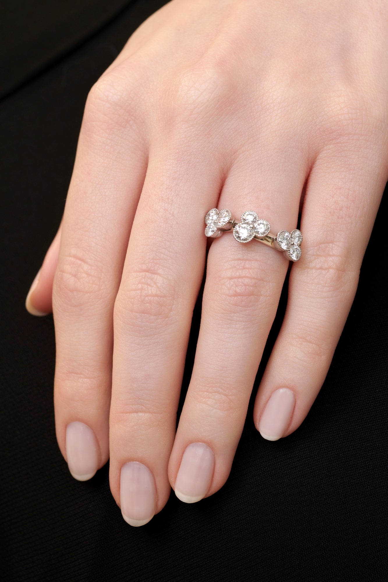 A diamond trefoil wave ring