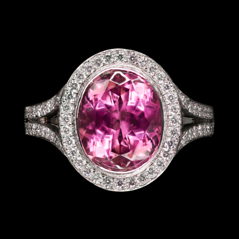 An Oval Pink Tourmaline & Diamond Cluster Ring