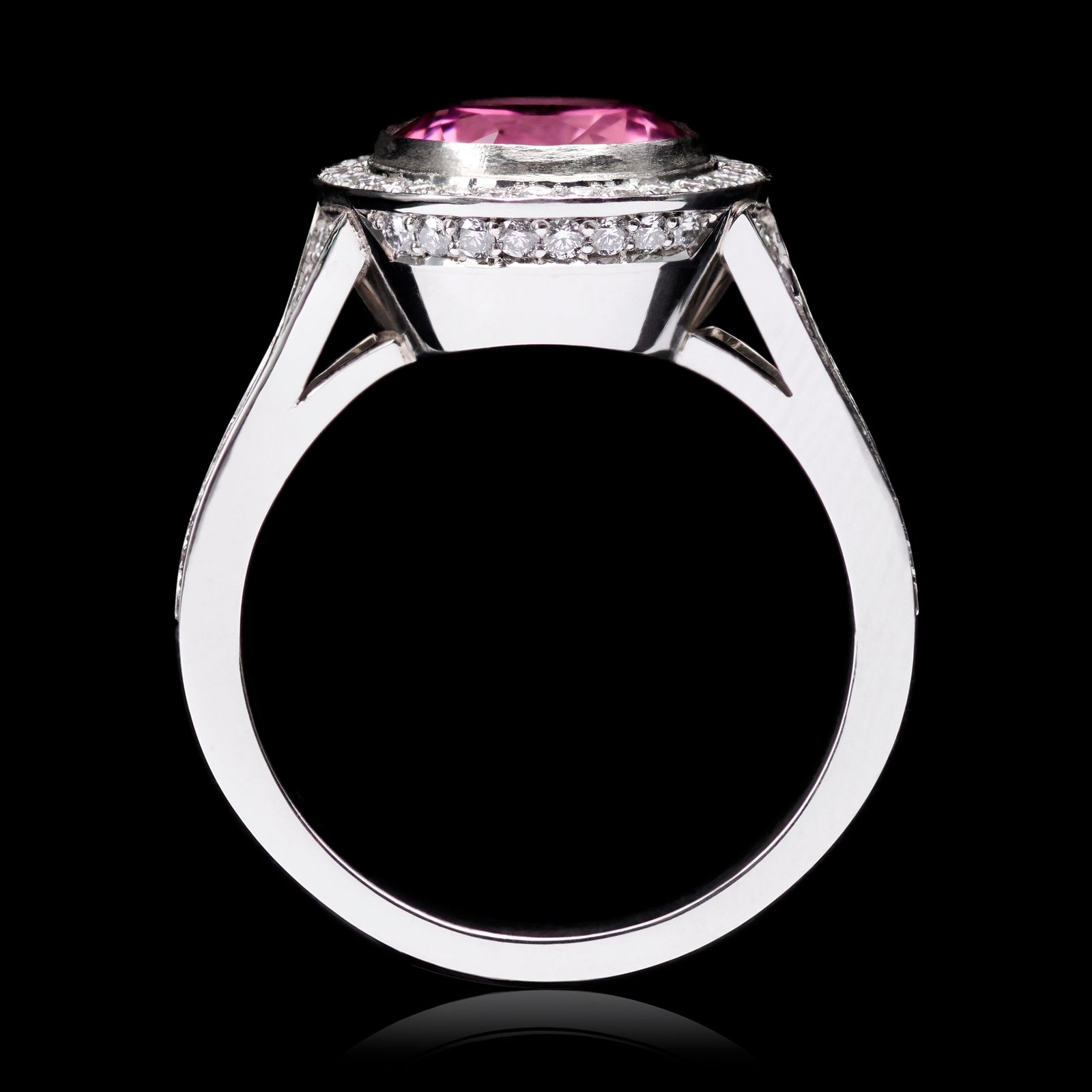 An Oval Pink Tourmaline & Diamond Cluster Ring