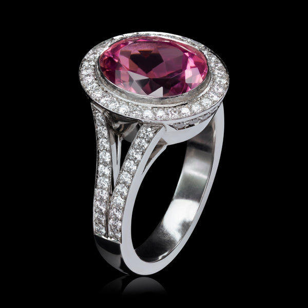 An Oval Pink Tourmaline & Diamond Cluster Ring