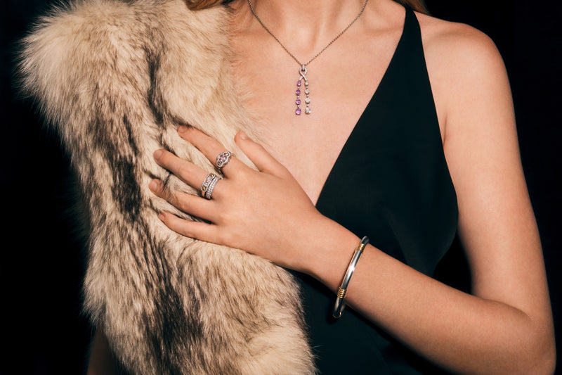 An all diamond half hoop ring with three fancy natural colour diamonds.