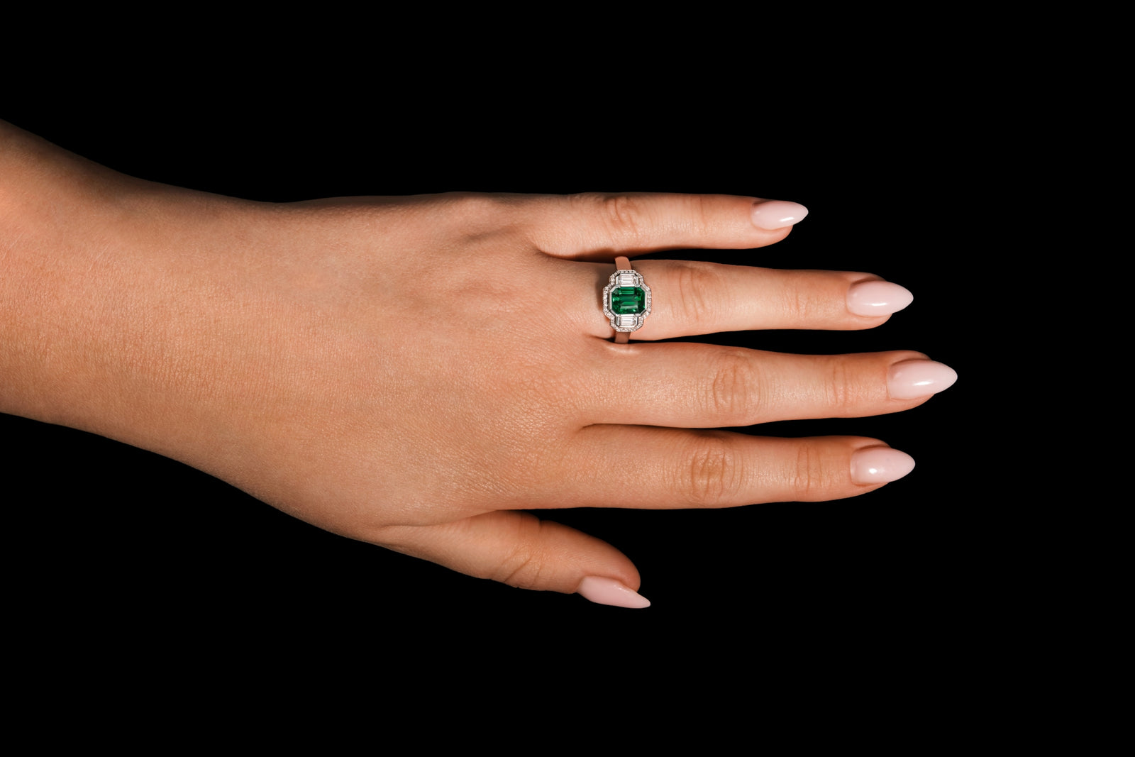An Emerald & Diamond Three Stone Cluster Ring