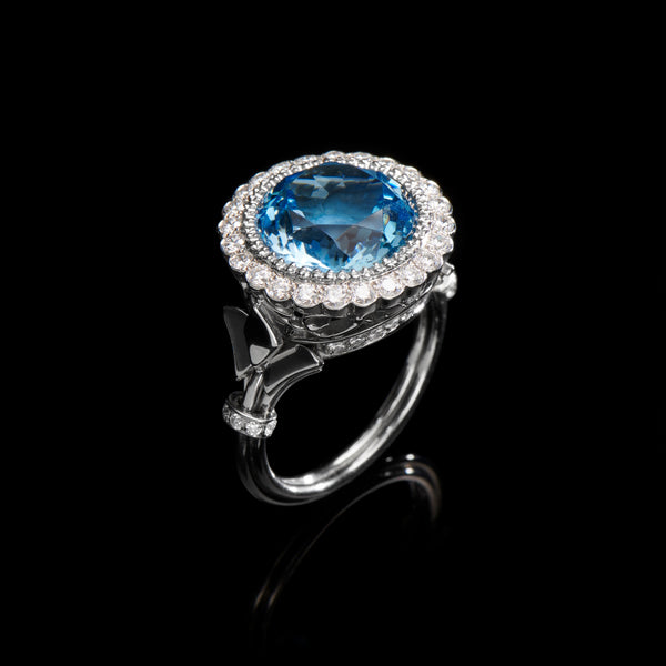 An entirely unique aquamarine & diamond cluster ring.