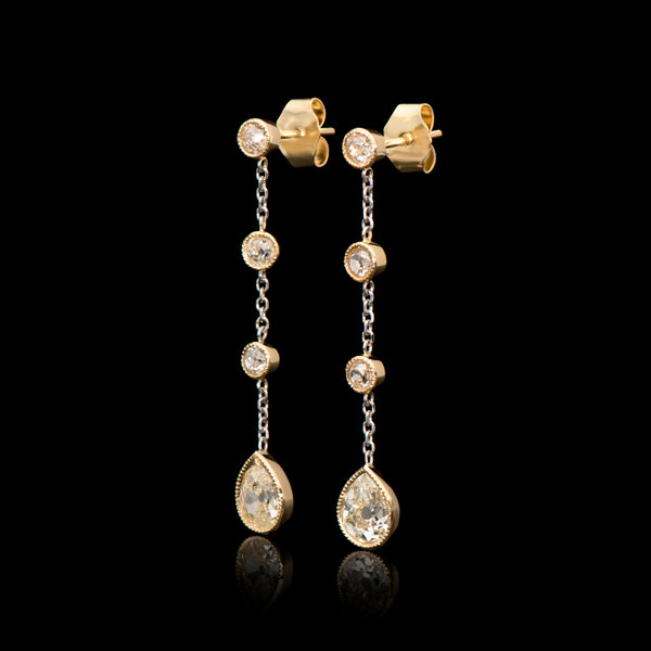 A pair of distinctive diamond drop earrings