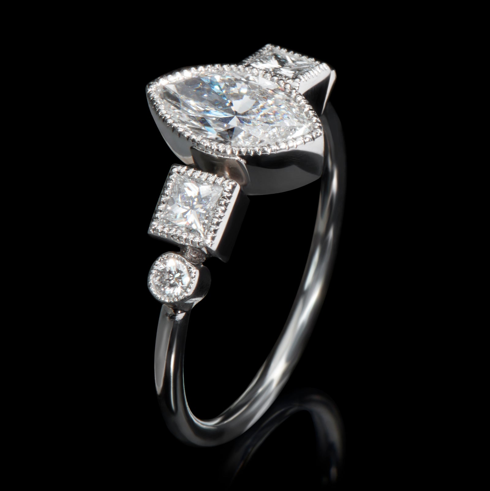 A navette, carree & brilliant cut diamond ring