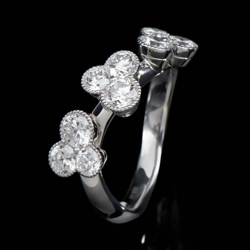 A diamond trefoil wave ring