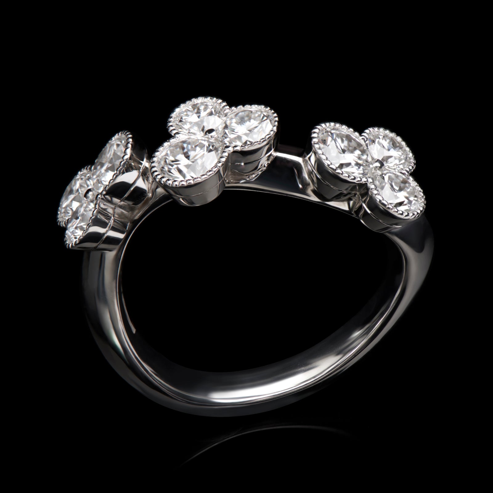 A diamond trefoil wave ring