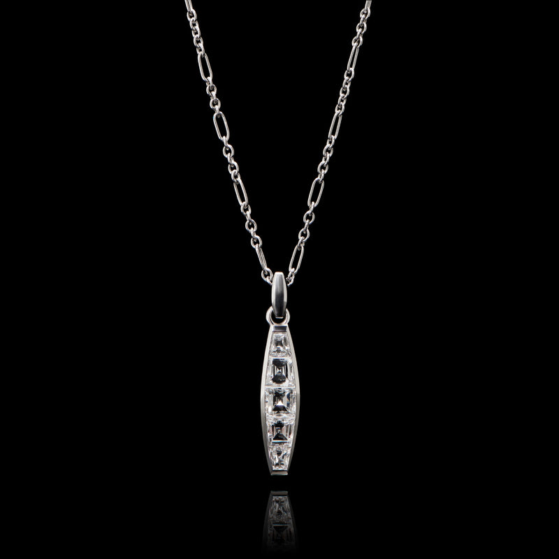 A diamond five stone tonneau baton pendant