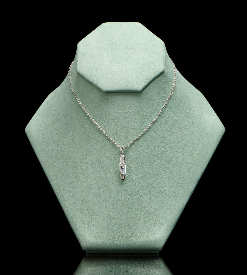 A diamond five stone tonneau baton pendant