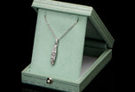 A diamond five stone tonneau baton pendant