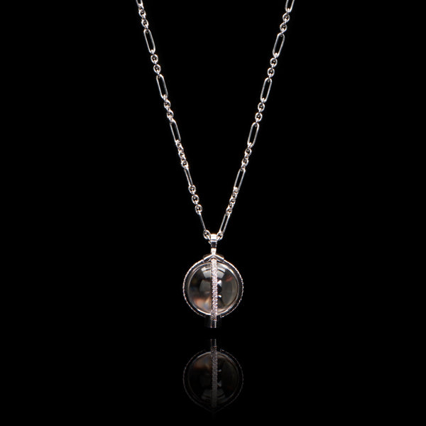 A rock crystal & diamond orb pendant