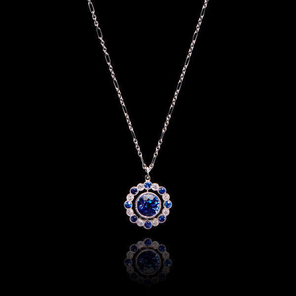 One & Sixteen A sapphire and diamond pendant